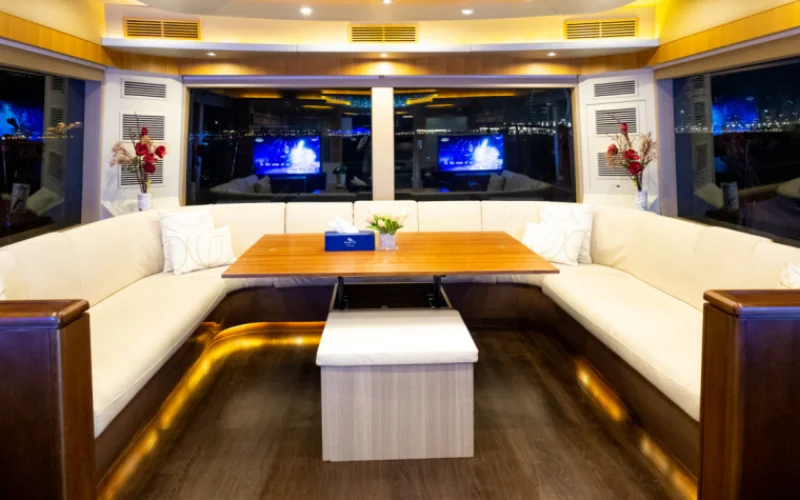 "Refined wooden finishes and open-plan interior in Explora yacht – Mala Yachts trusted yacht rental Dubai service"
