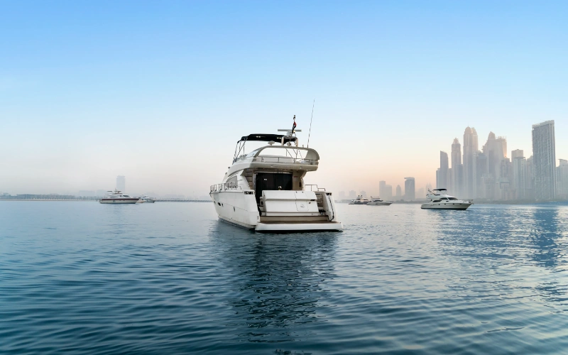 Docked Gulf Craft 60ft yacht near Dubai Marina, ready for an unforgettable voyage – discover true marine luxury with Mala Yachts’ yacht rental in Dubai.