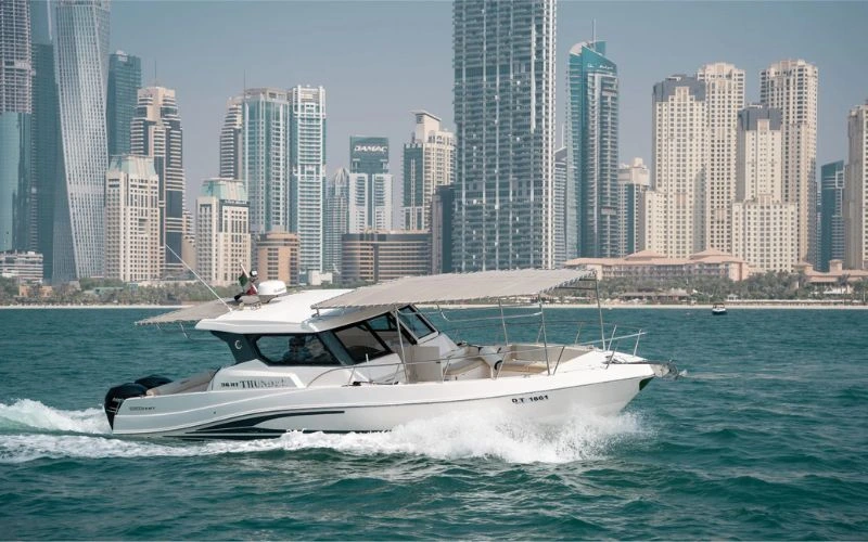Front view of the Storm 36ft yacht cutting through calm Dubai waters – Mala Yachts delivers top-notch yacht rental in Dubai for small groups.