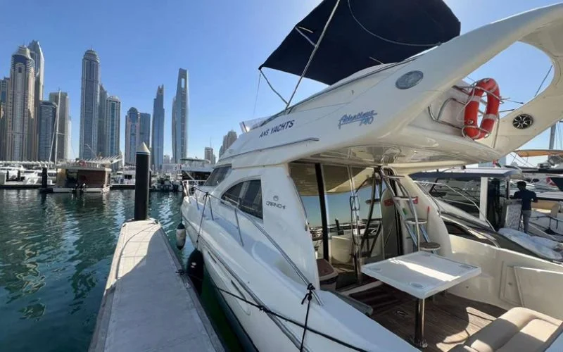 Sleek Cranchi yacht cruising along Dubai’s iconic coastline – discover elegance and performance with Mala Yachts’ premium yacht rental in Dubai.