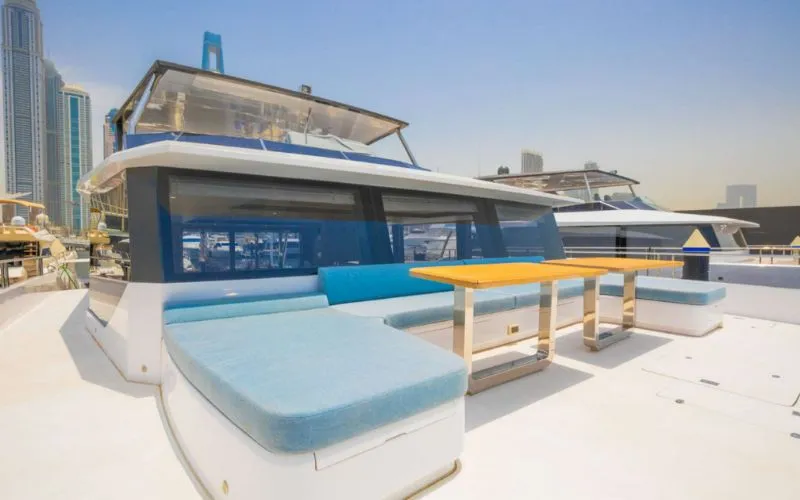 "Stylish and spacious salon in 61SW yacht – Mala Yachts premium yacht rental Dubai experience"
