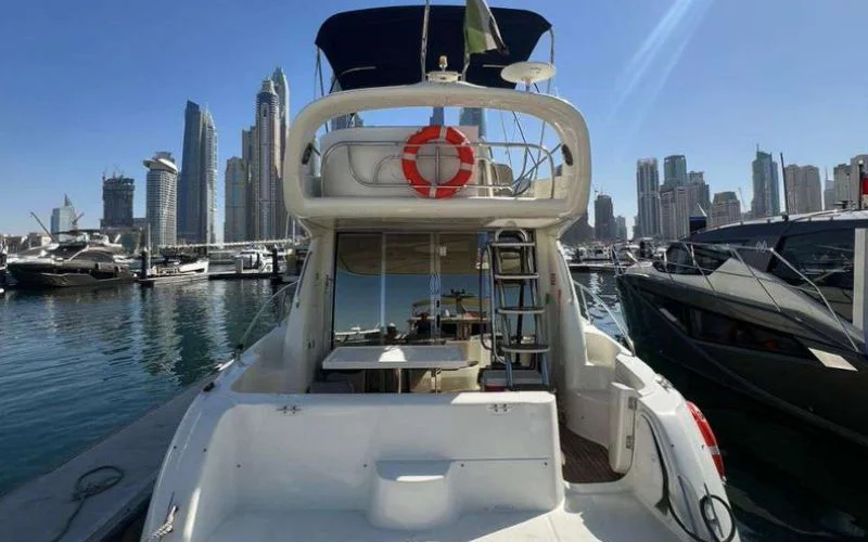 Cranchi yacht docked at Dubai Marina, reflecting Italian design and maritime excellence – elevate your sea journey with Mala Yachts’ yacht rental in Dubai.
