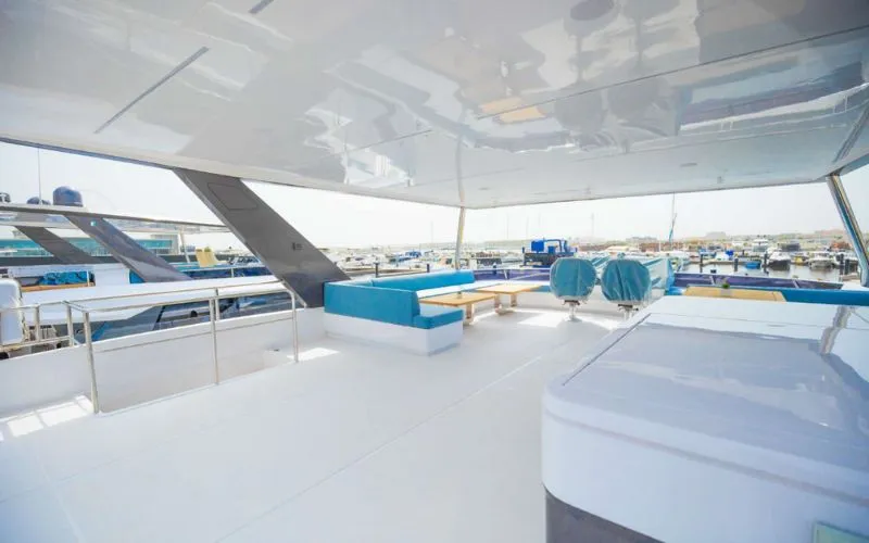 "Fully furnished dining space aboard 61SW yacht – Mala Yachts exclusive yacht rental in Dubai"