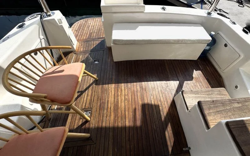 Top-deck lounging area on the Riviera yacht with panoramic Dubai views – relax in style through Mala Yachts’ exclusive yacht rental in Dubai.