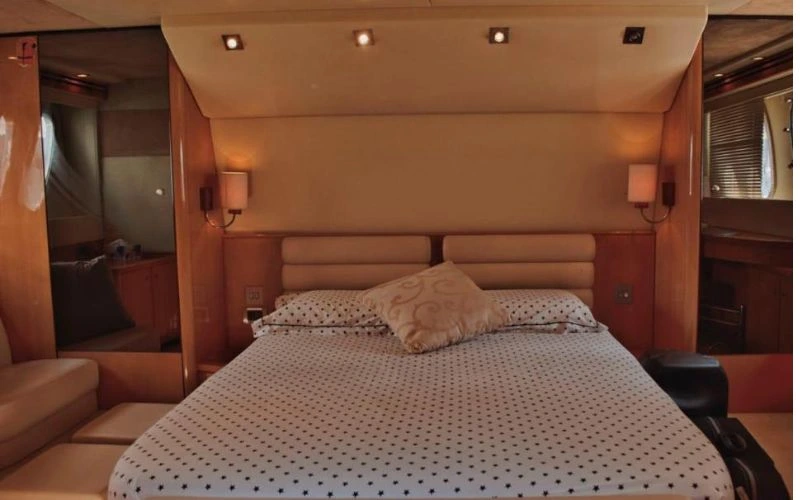 Cozy bedroom suite aboard a luxury yacht by Mala Yachts – perfect for overnight yacht rental in Dubai.