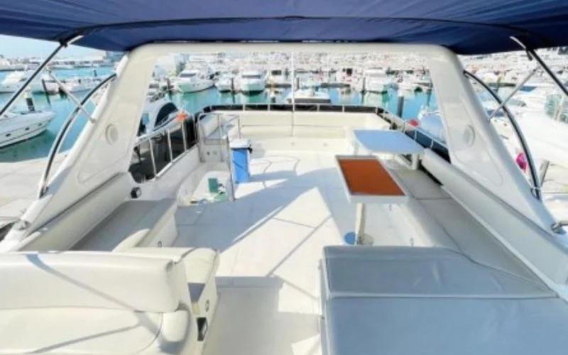 Spacious outdoor deck of Majesty 70ft yacht with elegant seating and open views of Dubai’s coastline – embrace open-air luxury with Mala Yachts’ yacht rental in Dubai.