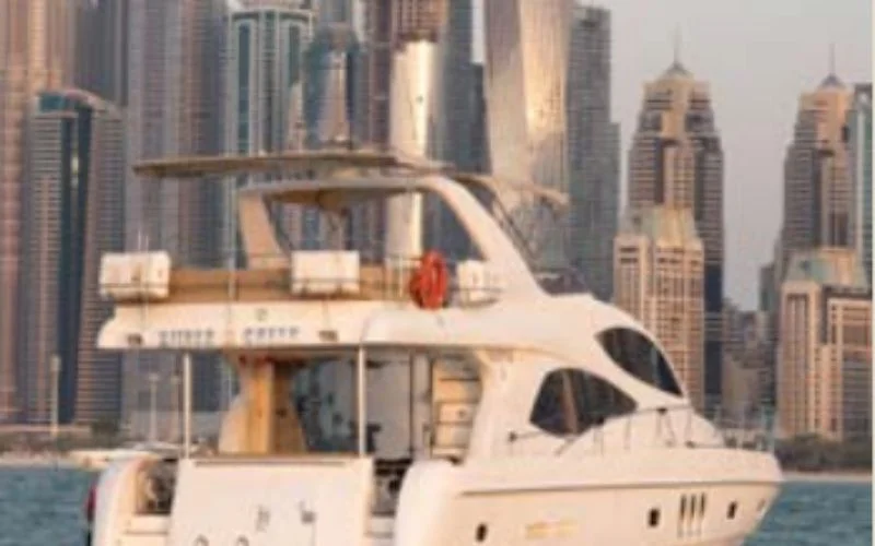Silver Creek yacht cruising through Dubai’s blue waters with the skyline in view – Mala Yachts offers exceptional yacht rental in Dubai for luxury sea tours.