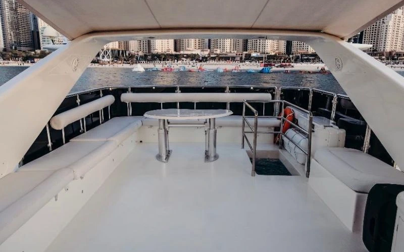 Azimut 80 docked with Dubai Marina skyline backdrop – Mala Yachts offers unforgettable yacht rental Dubai experiences.