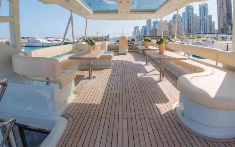 "Stylish salon area with panoramic windows in Explora 60ft yacht – Mala Yachts premium yacht rental Dubai"