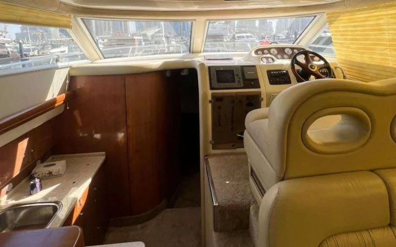 Captain’s control area on Cranchi yacht with modern navigation system – yacht rental in Dubai by Mala Yachts