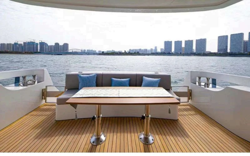 Spacious outdoor deck on the Meridian 45ft yacht with cushioned seating, perfect for relaxing under Dubai’s skyline – unwind in style with Mala Yachts’ yacht rental in Dubai.