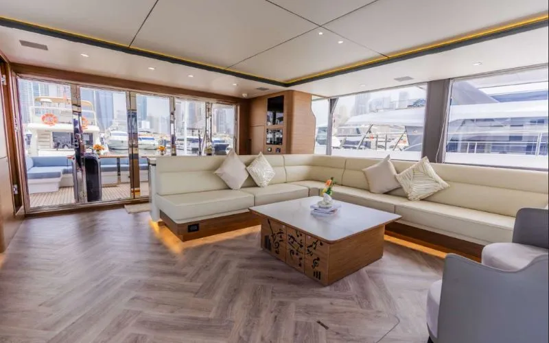 "Chic and comfortable interior seating area in 61SW yacht – Mala Yachts luxury yacht rental in Dubai"