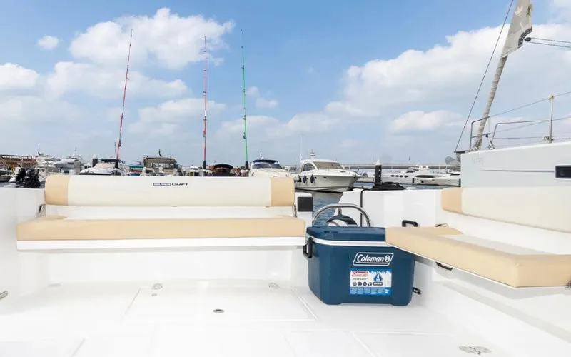 Relaxing lounge area inside the Storm 36ft yacht – enjoy a cozy and comfortable yacht rental in Dubai with Mala Yachts.