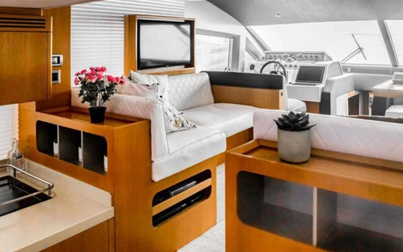 "Elegant seating area with panoramic windows in Majesty 48 yacht – Mala Yachts luxury yacht rental in Dubai"