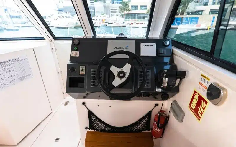 Captain’s control area of the Thunder yacht with advanced navigation equipment – Mala Yachts ensures safe and professional yacht rental in Dubai experiences.