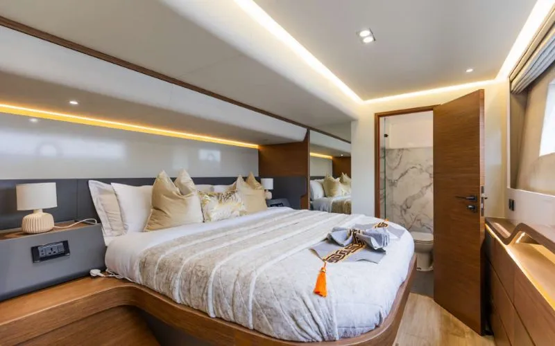"Luxurious bedroom suite inside 61SW yacht featuring modern comfort – Mala Yachts premium yacht rental in Dubai"