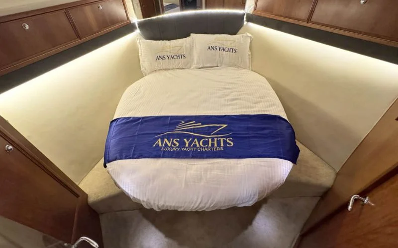 Spacious bedroom cabin on the Riviera yacht featuring refined finishes – Mala Yachts provides peaceful overnight stays with yacht rental in Dubai.