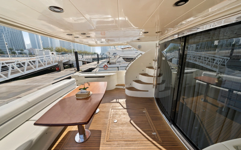 Dining space within Gulf Craft 60ft yacht featuring a sleek table and seating for guests – dine aboard with Mala Yachts’ yacht rental in Dubai.