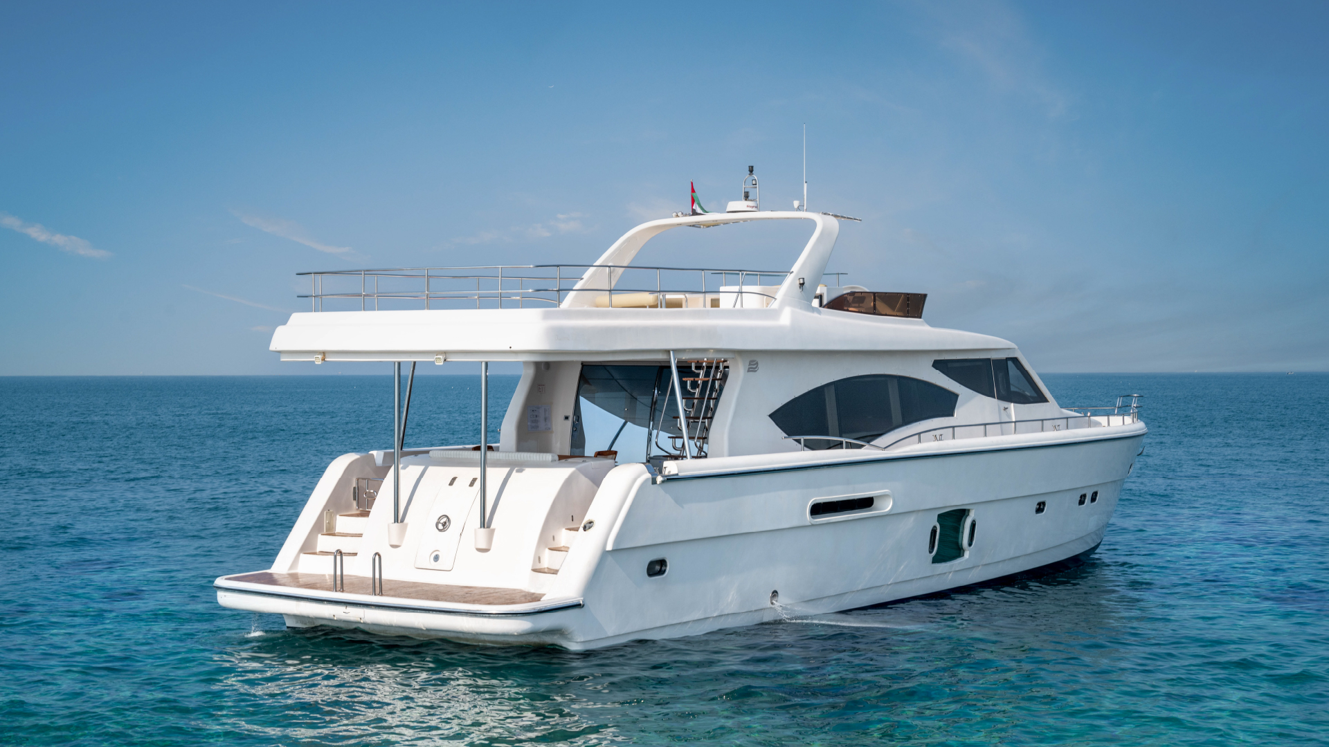 Kronos yacht docked at Dubai Marina with a sleek and modern design – experience elite yacht rental in Dubai with Mala Yachts.