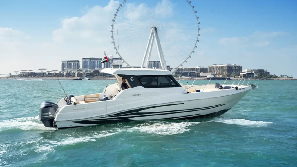 The aft deck lounge area of the 36ft yacht Dubai from Malayachts.ae, with marina views.