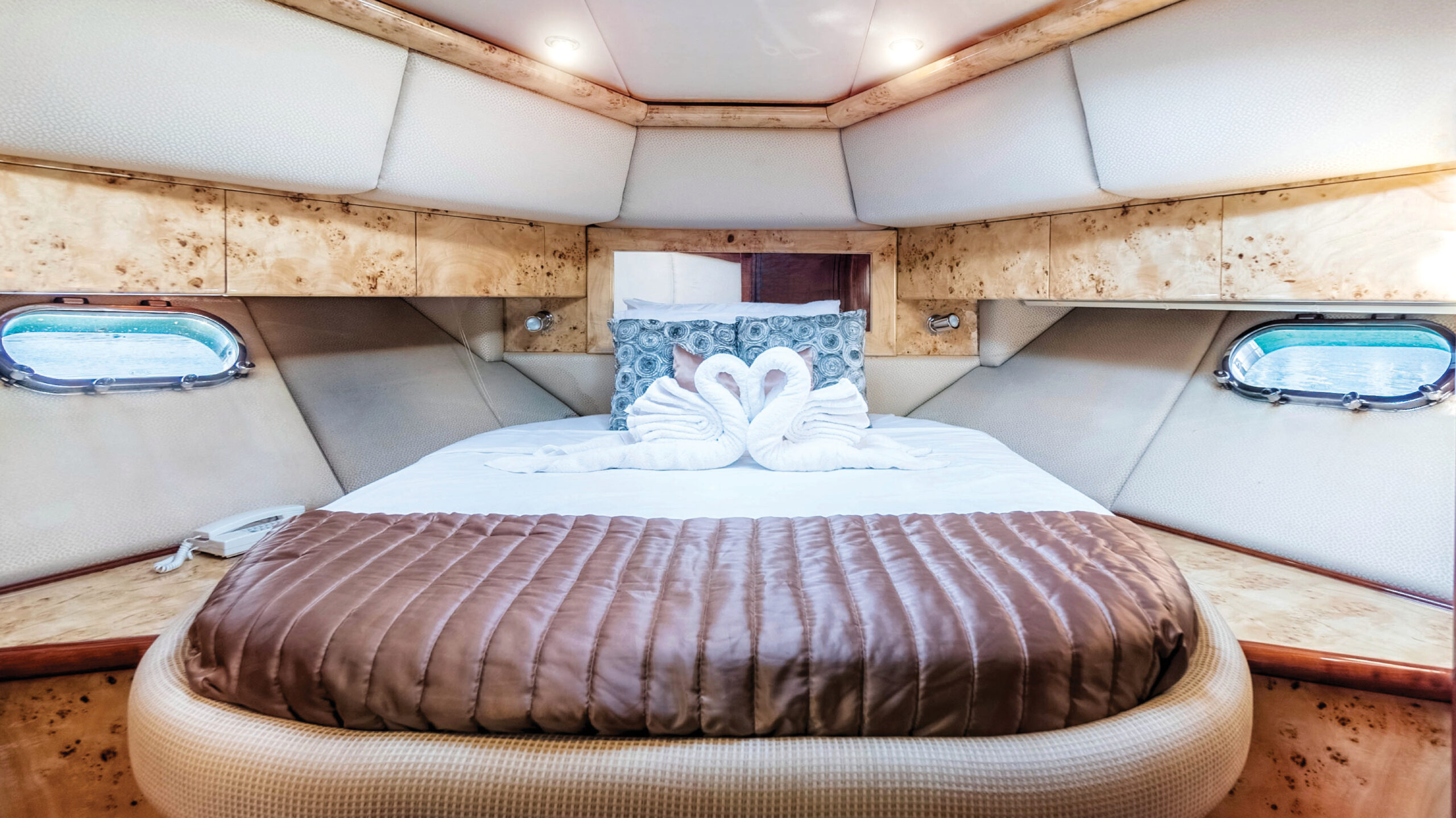 Stylish and spacious bedroom inside the Silver Creek yacht with soft lighting and upscale décor – experience ultimate relaxation with Mala Yachts’ luxury yacht rental in Dubai.