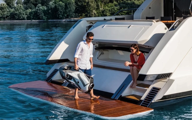 Aerial view of Ferretti 67 showcasing its spacious decks and contemporary design – explore the sea in style with Mala Yachts’ yacht rental in Dubai.