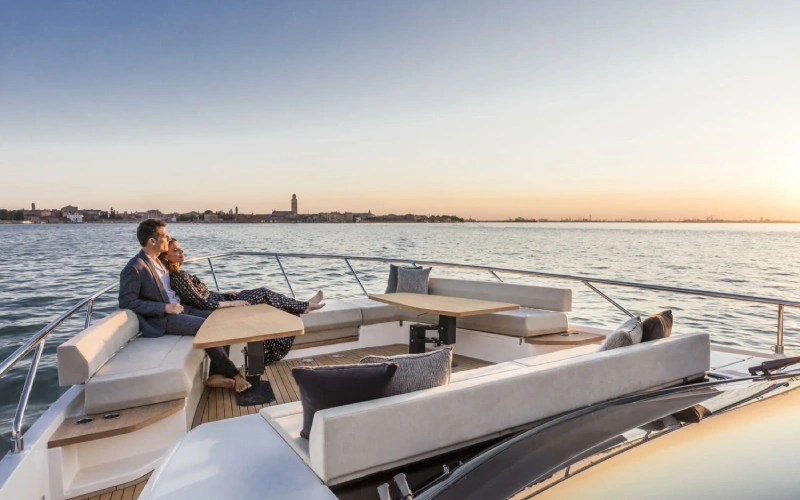 Flybridge on Ferretti 67 with sun loungers and open-air relaxation space – soak in the skyline with Mala Yachts’ luxury yacht rental in Dubai.