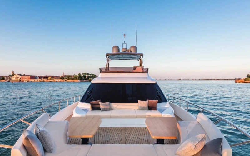 Back view of Ferretti 67 featuring an extended swim platform – enjoy seamless sea access with Mala Yachts’ premium yacht rental in Dubai.