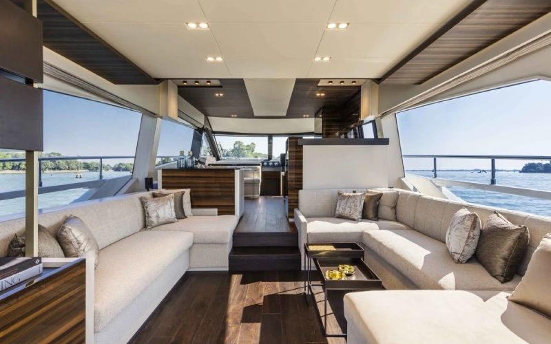 Modern master suite on Ferretti 67 with refined décor and panoramic sea views – redefine comfort with Mala Yachts’ yacht rental in Dubai.