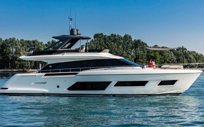 Ferretti 67 yacht cruising near Dubai Marina with sleek lines and refined profile – discover ocean elegance with Mala Yachts’ yacht rental in Dubai.