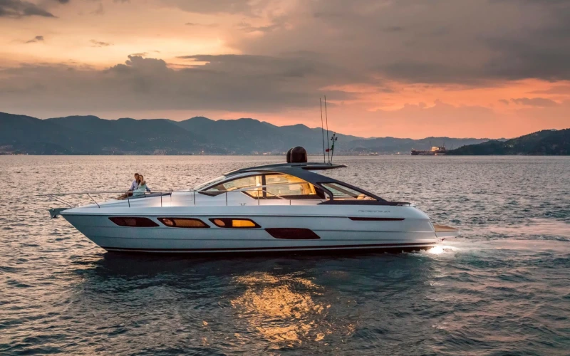 Sleek exterior of the Pershing 5X 2024 yacht with sporty lines and dynamic profile – experience cutting-edge elegance with Mala Yachts’ yacht rental in Dubai.