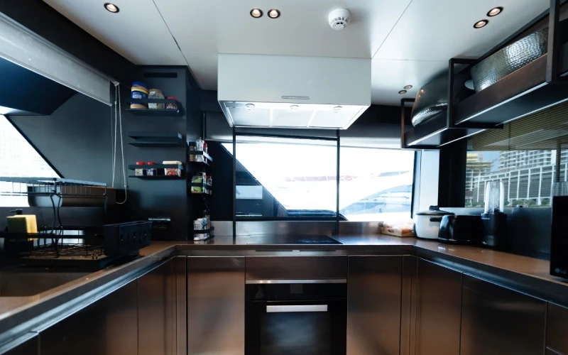 Modern kitchen onboard Sanlorenzo yacht with built-in appliances – yacht rental in Dubai by Mala Yachts