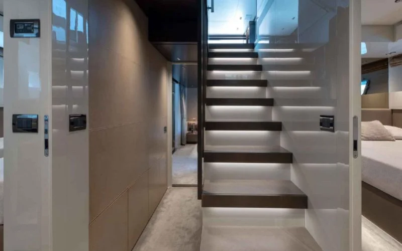 The modern interior staircase and hallway of the luxury yacht Tiberias from Malayachts.ae.