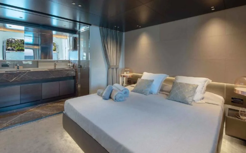 Experience ultimate comfort in the opulent master cabin of the Tiberias yacht, perfect for a luxurious charter with Malayachts.ae.