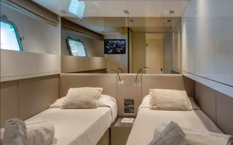 Comfortable sleeping accommodations in a twin cabin on the Tiberias yacht, perfect for guests on a charter with Malayachts.ae.