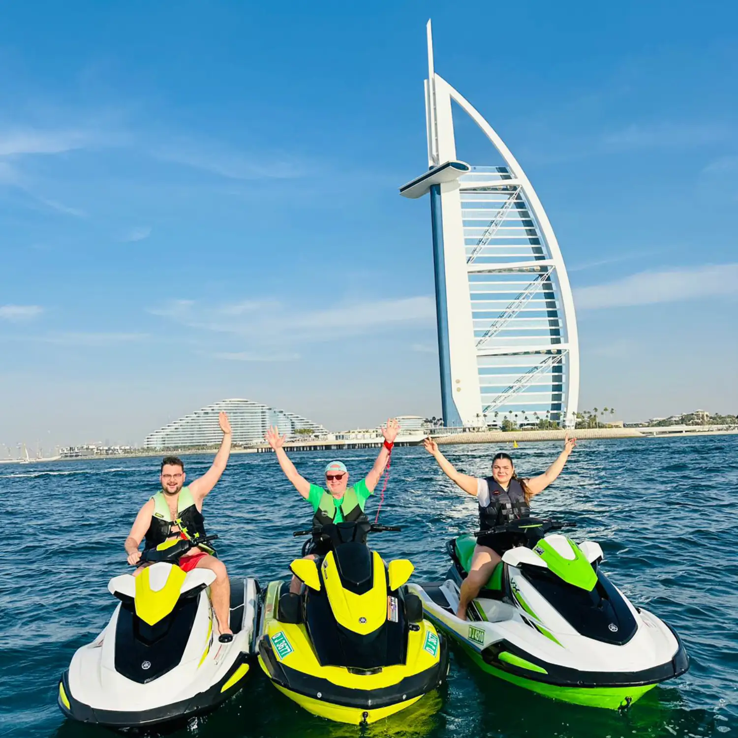 Jet ski parked next to a private yacht in the sea